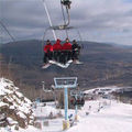 Snowboarders on a chair lift