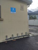 Low security wheelbender style bicycle-parking wall-loop, in Fontaine 38600, France