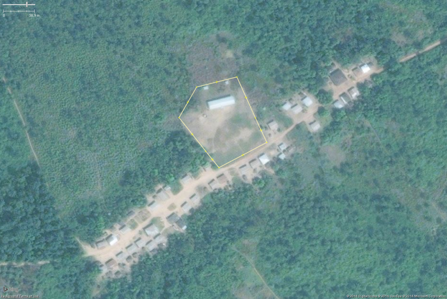 A typical rural school in West Africa. This zoomed in view shows the key features: 1 or 2 long buildings, 1 or 2 smaller toilet buildings, a large bare field. The overall school property should be tagged with amenity=school and the buildings with building=yes.